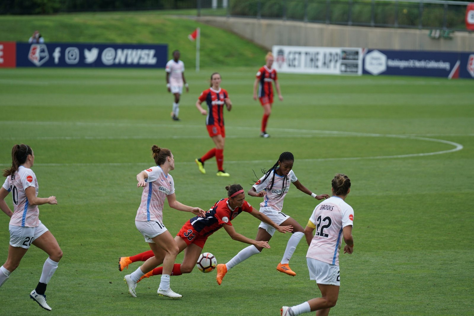 woman playing soccer on field